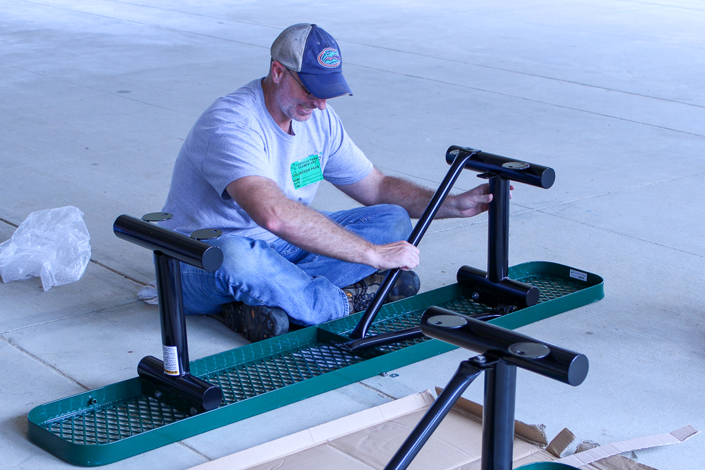 Volunteer assembles bench