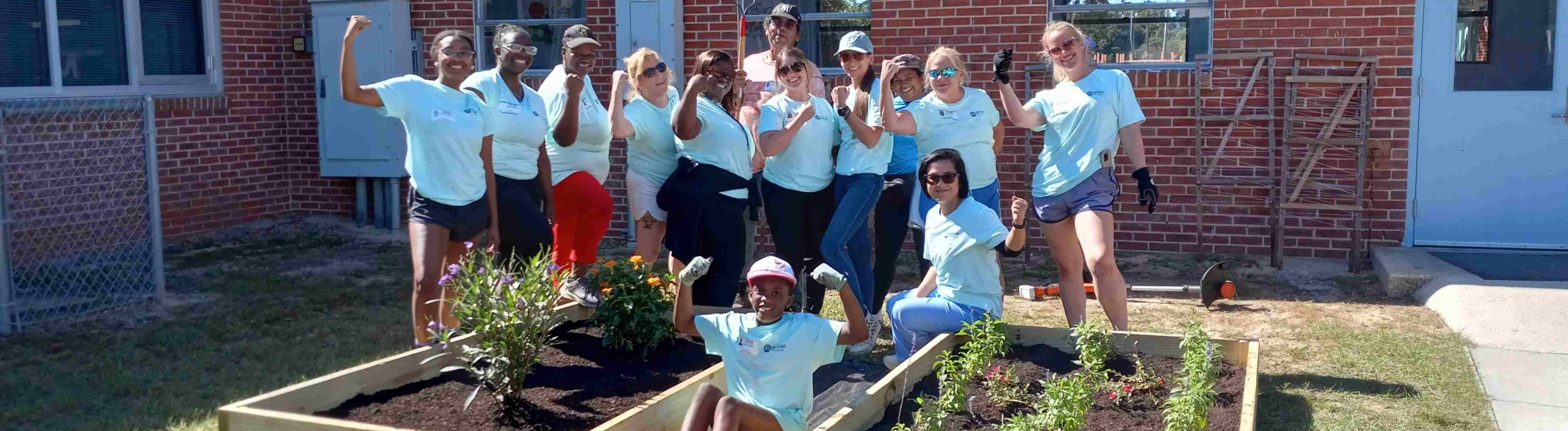 photo of 12 people outside in a garden