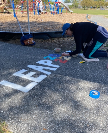 Christine Deckert adds the LeaP Class 2022 logo to Chimes Way-min.jpg
