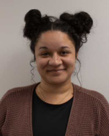 Photo of a girl with dark curly hair