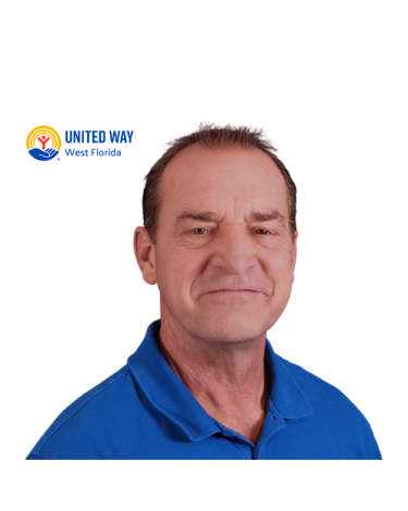 Man wearing a blue collar shirt smiling with a white background.