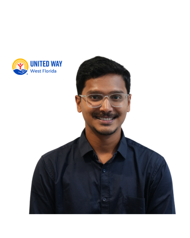 A man wearing glasses and a dark collared shirt smiling at the camera with a white background.