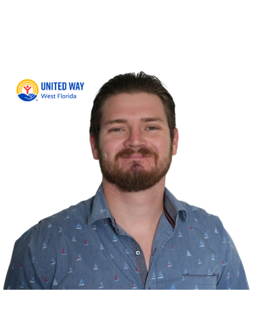 Photograph of a man in a blue collar shirt smiling.